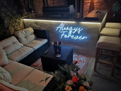 always and forever neon sign at home in the garden