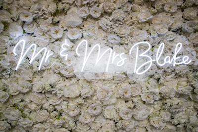 sign on a flower wall
