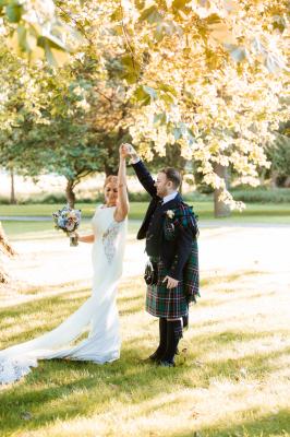 Bride and groom enjoying a dance on the grounds of brocket hall