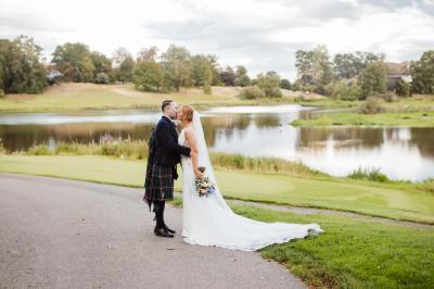 Bride and groom sharing a kiss at Brocket Hall, Welwyn
