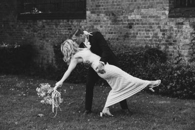 Bride and groom sharing a dip kiss at St Albans Register Office