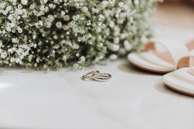 Wedding rings shoes and flowers