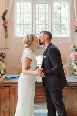 Bride and groom sharing their first kiss at Cheshunt Register Office